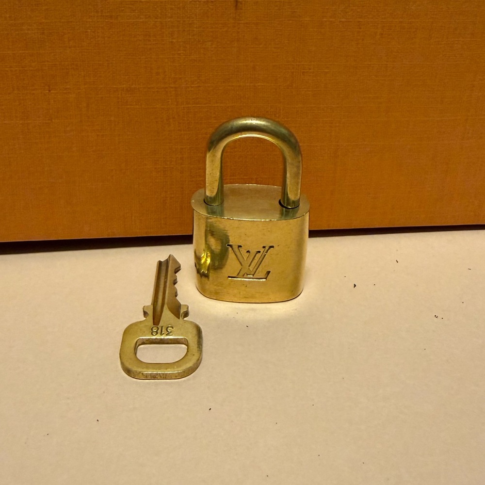 Louis Vuitton Gold Padlock with Key Authentic
